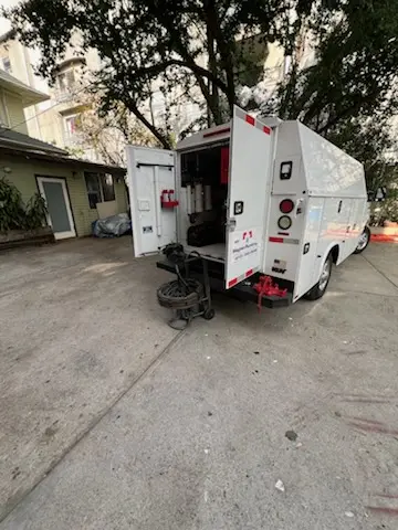 Magnet Plumbing service vehicle on-site for Grease Trap Cleaning in Perdew Island